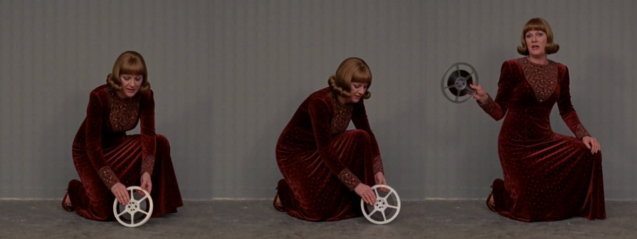 Three cropped frames: a woman kneels, sets down a film reel, and holds it up