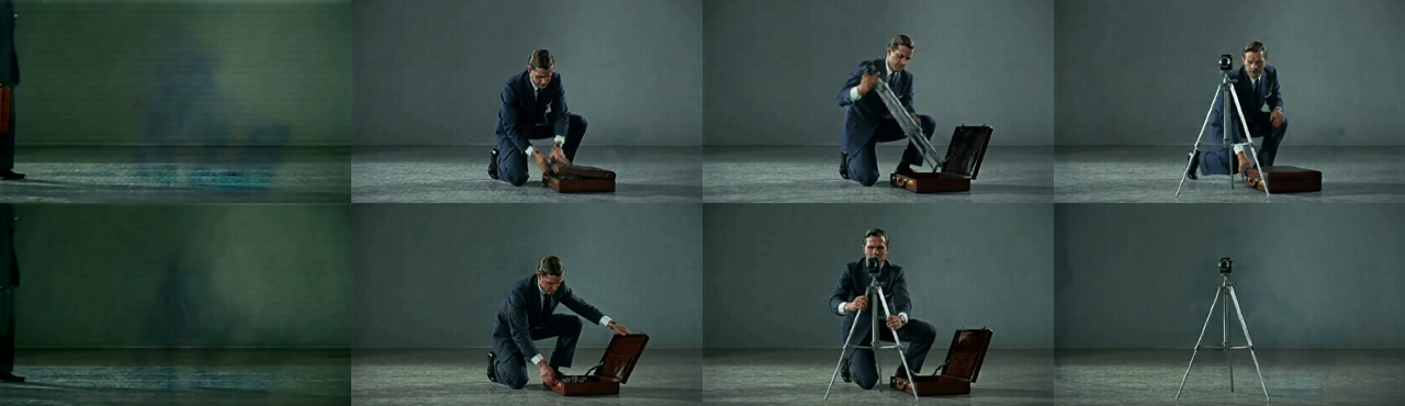 Eight video frames in two rows of four. Both rows show the same shot: a man
in a dark suit kneels on a grey studio floor, opens a briefcase, and assembles
a camera on a tripod. The top row is the 241-frame ExVideo/RifleX guide at 12
fps; the bottom row is the 297-frame stepped VACE guide at 24 fps. The first
frame of each row is a dim green-grey smear before the subject resolves. By the
fourth frame the top row still holds the man beside the tripod while the bottom
row has left only the tripod standing in an empty
room.